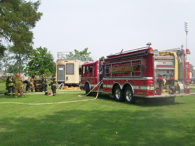 Firefighters conduct live fire training in the Departments training trailer